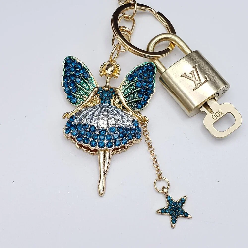 Authentic Louis Vuitton Lock & Key with Unbranded Fairy Charm, Keychain